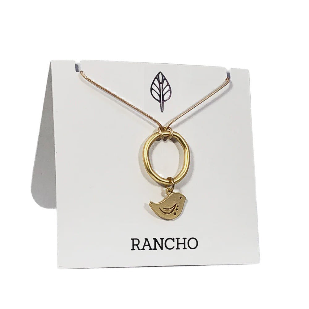 Gold Flat Ring + Silver Winged Bird on Tan Cord Necklace